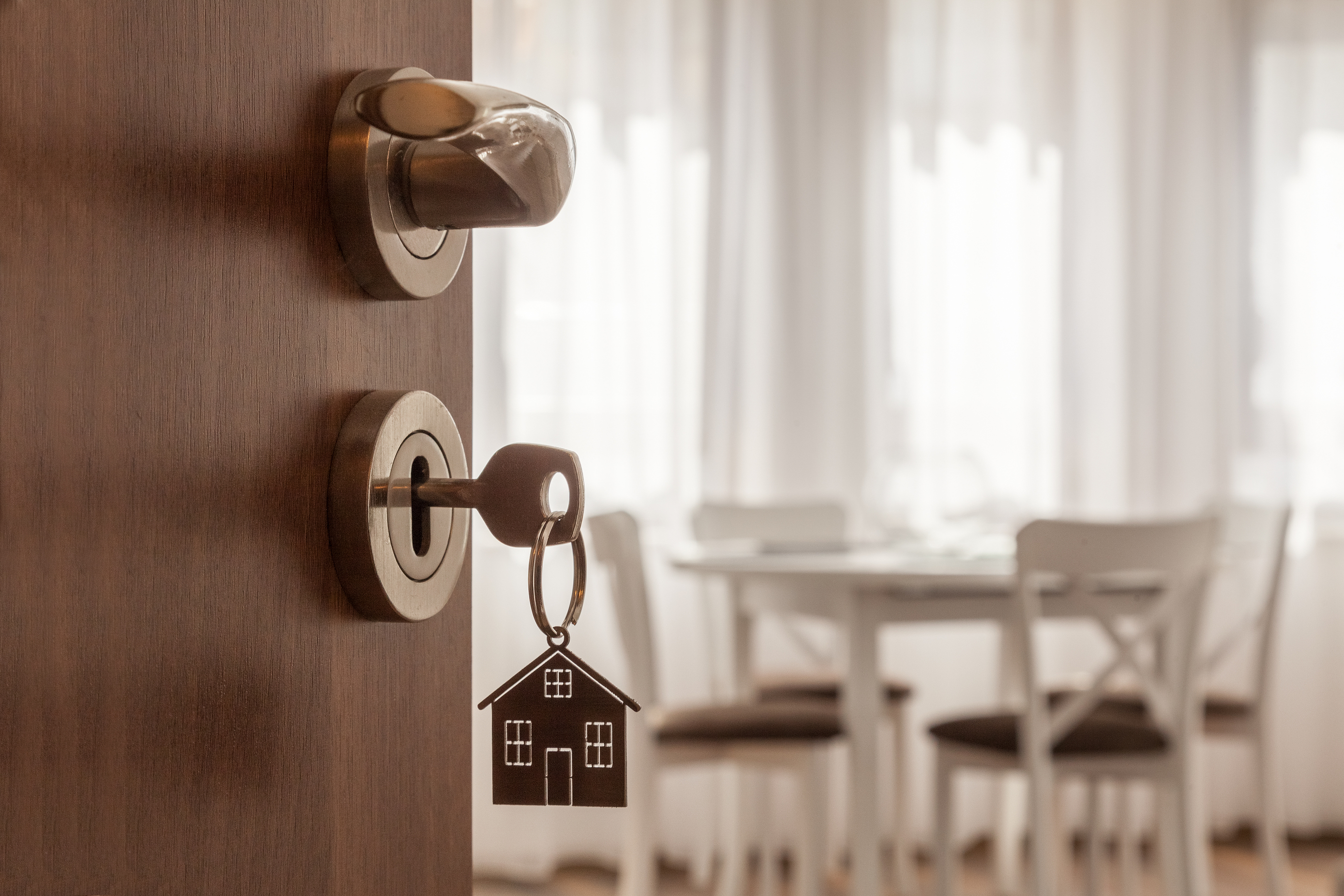 bigstock-Open-Door-To-A-New-Home-Door--239648071.jpg